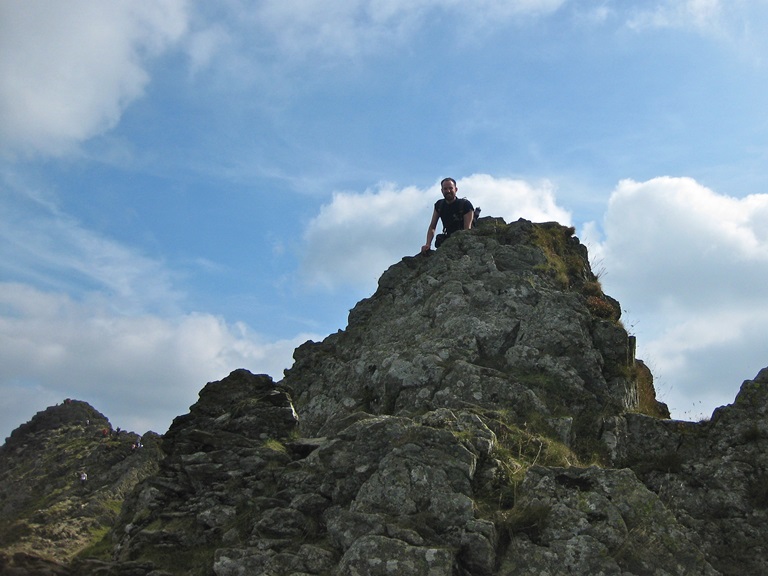 One of the crew on a rocky point of Helvellyn